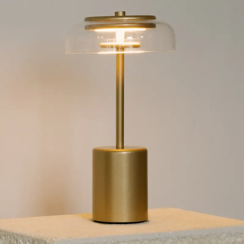 Nuura LED-batteridriven bordslampa Blossi, höjd 26 cm guldfärgad/klar Handla nu